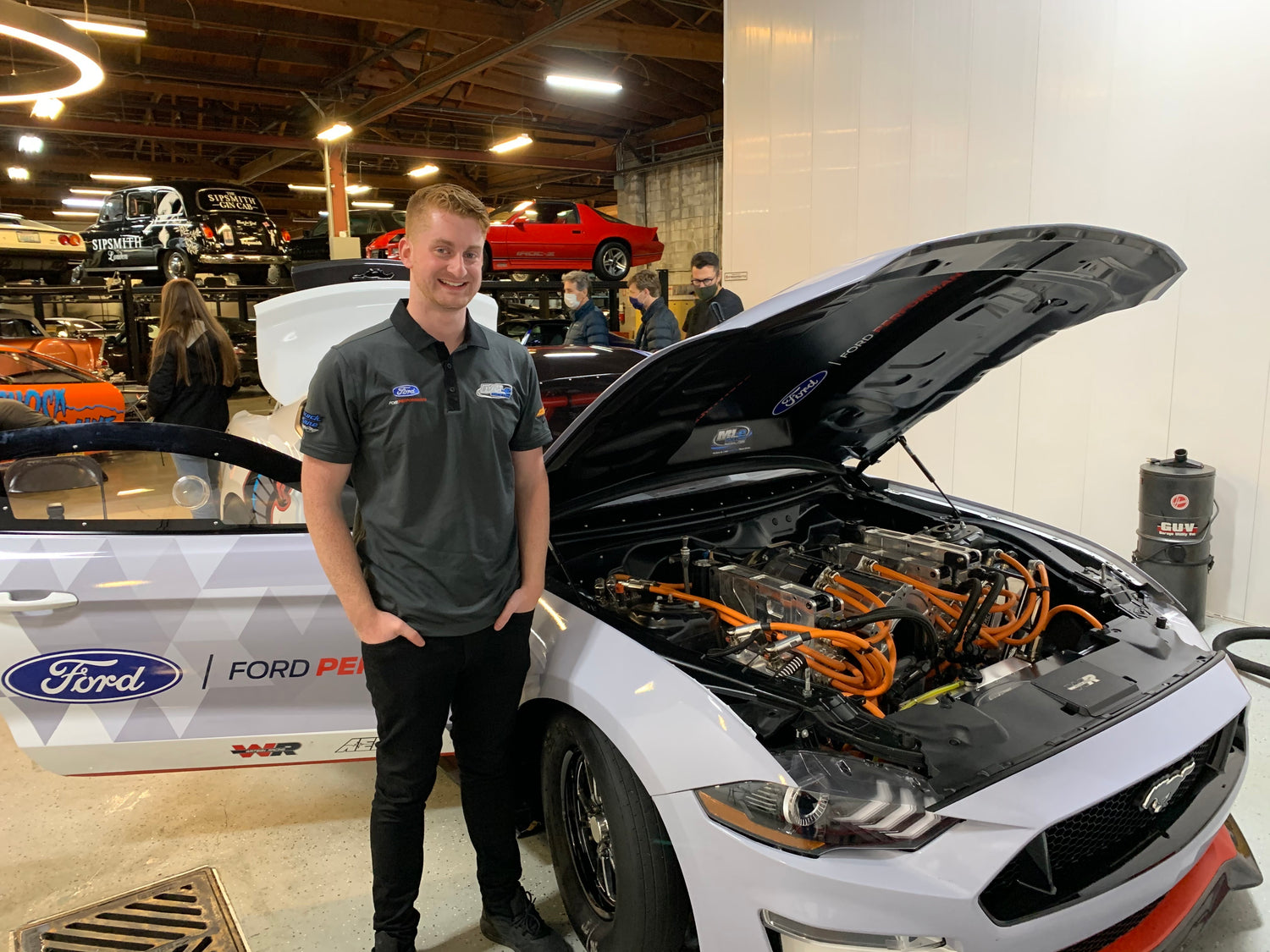 Scott standing next to the Mustang Cobra Jet 1400