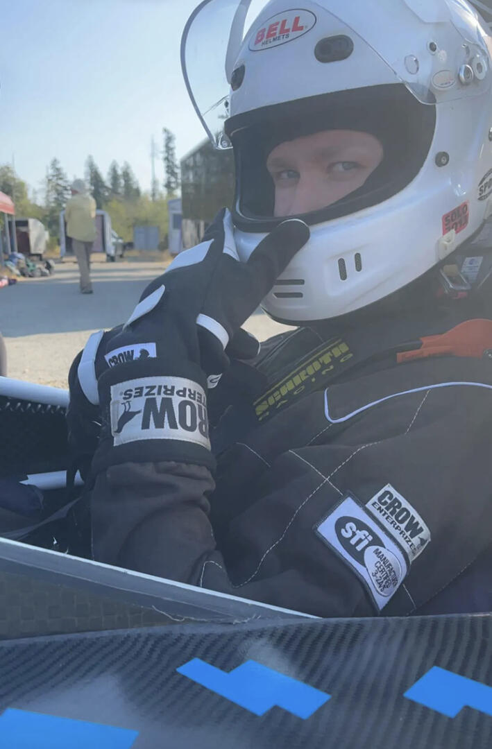 Chandler at the wheel of a Formula SAE car