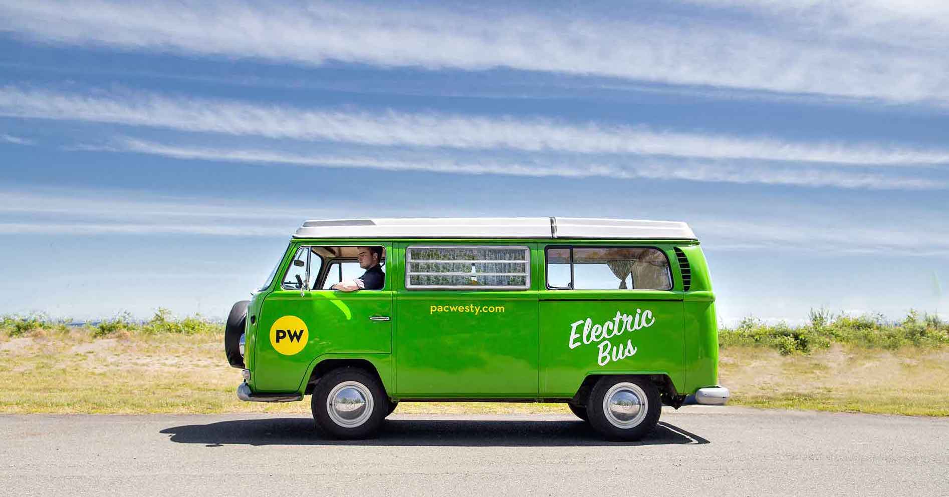 green electric bus out for a drive