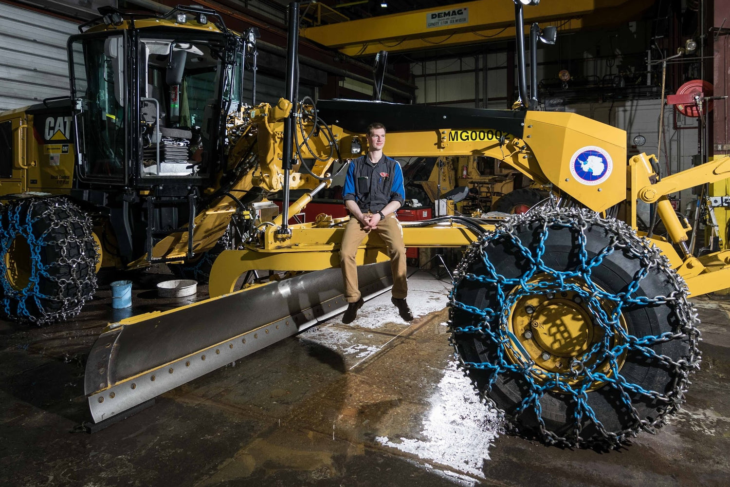 Travis sitting on a plow in antarctica