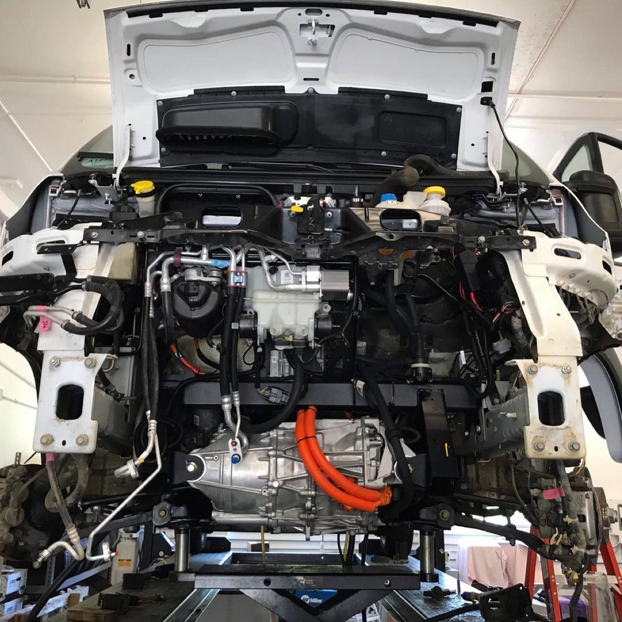 Tesla drive unit getting installed in promaster van
